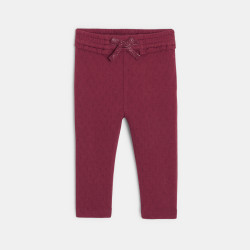 Baby girls' decorative pink knitted trousers with elasticated waistband